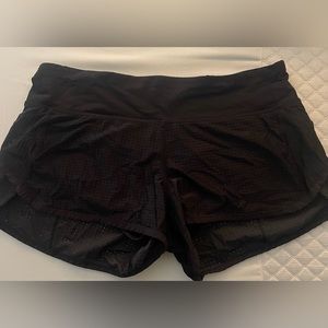 Black lululemon shorts with breathable holes size 4, 2.5’
